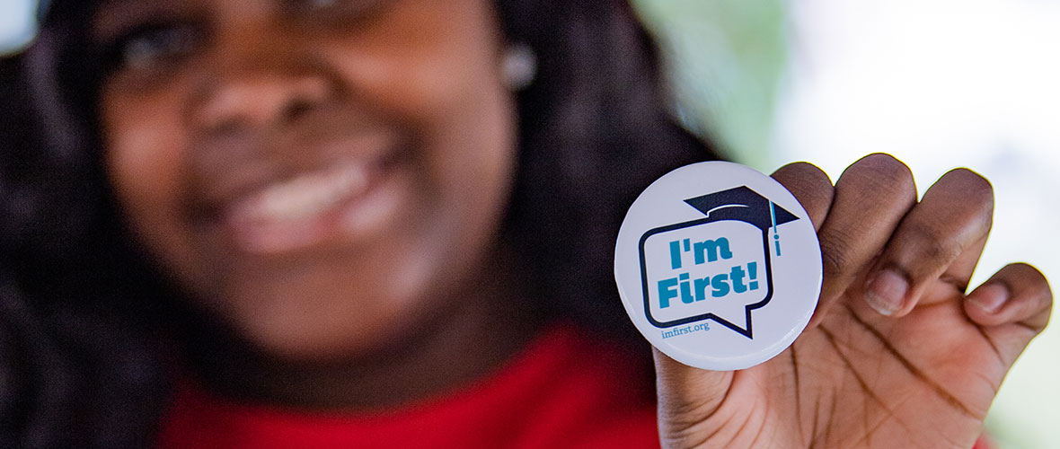 A proud JSU First-Gen student holds up her "I'm first" button