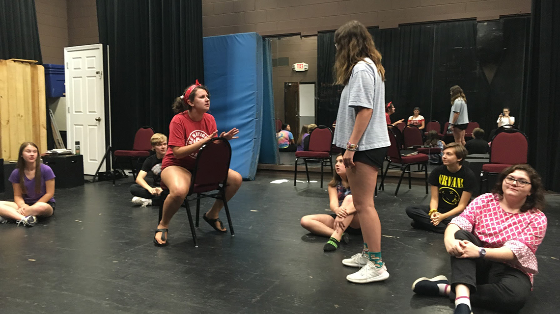 Students acting inside of Stone Center's black box theatre