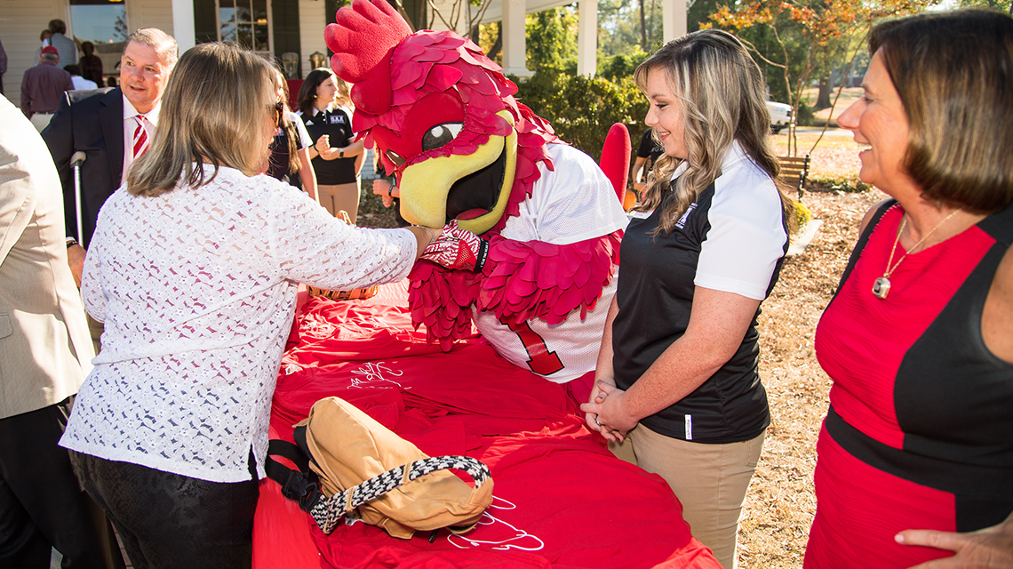 Cocky and the first lady greeting guests on Homecoming 2016