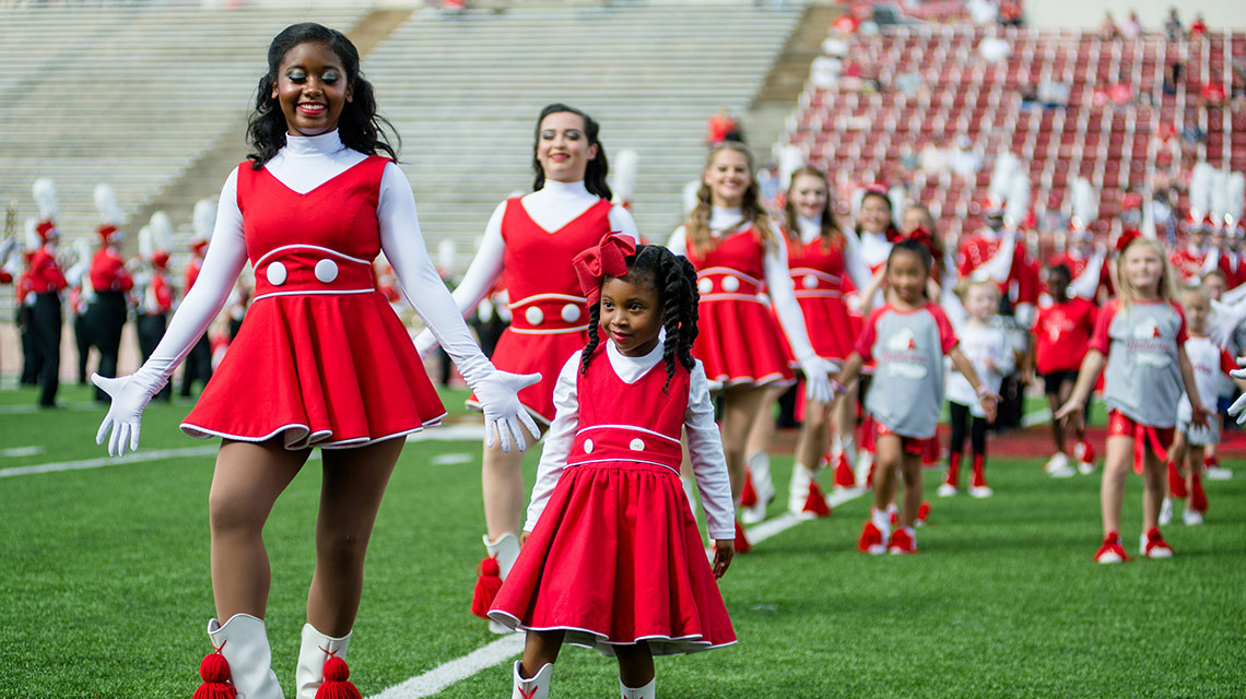 A Marching Ballerina and her young mentee