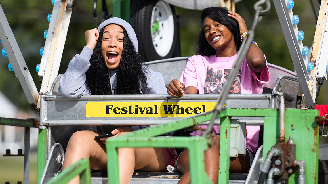 Two female JSU students on the ferris wheel at the Homecoming Carnival