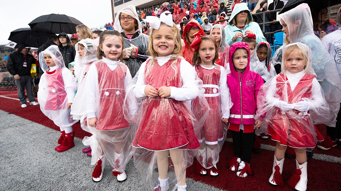 Little future Ballerinas, decked out in their Santa Suits and boots, wait to perform