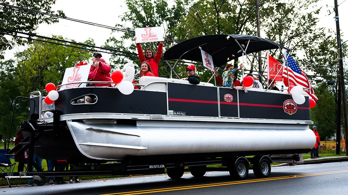 The J-Club rode in the parade on, appropriately, a pontoon boat