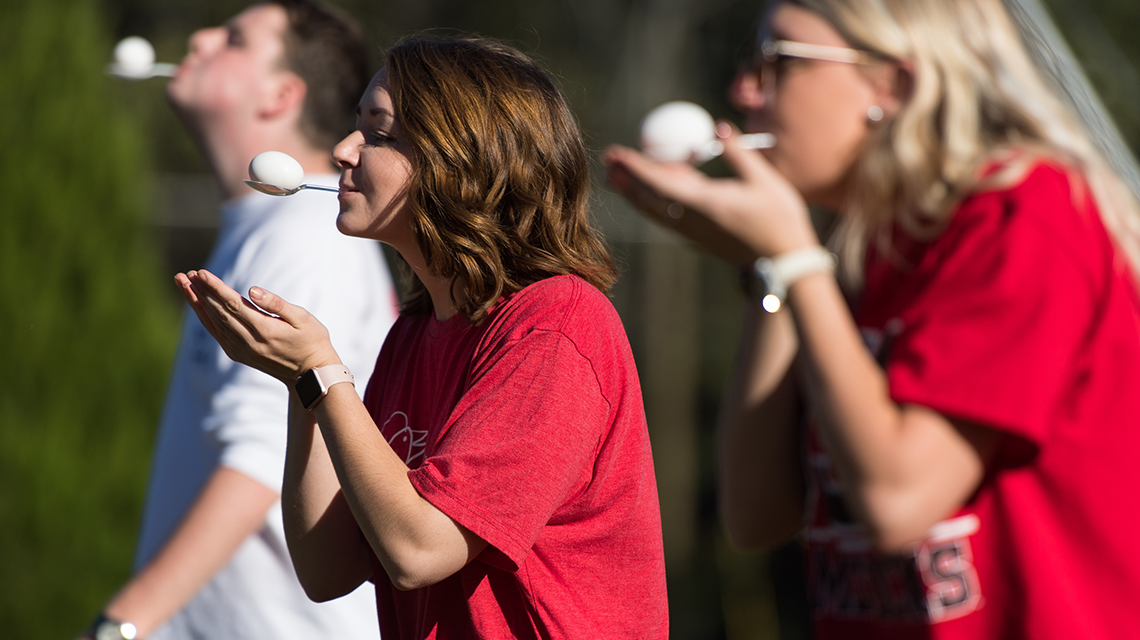 Students participating in egg carry