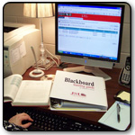 Faculty working on Blackboard course in office