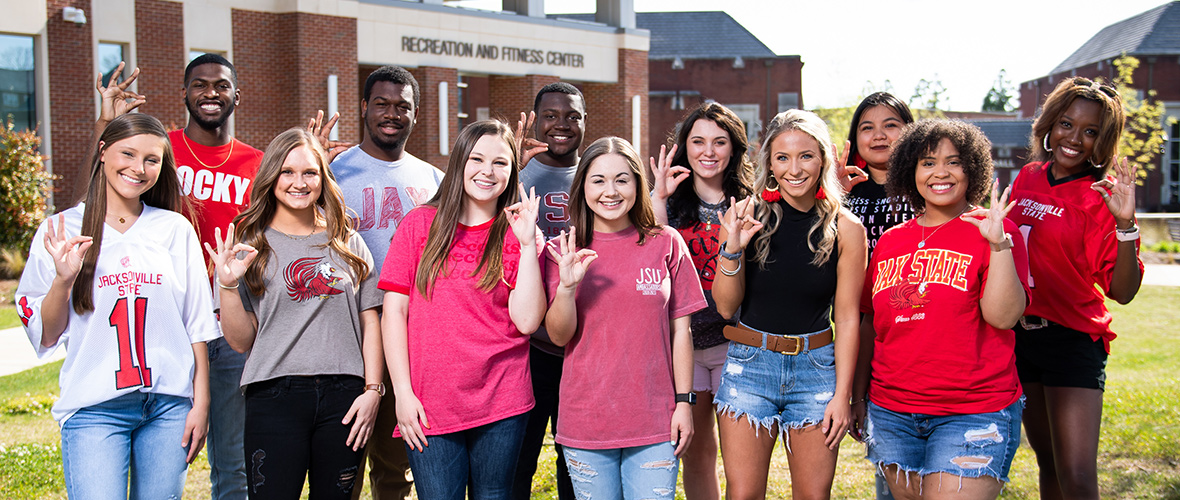 JSU Ambassadors show their "Fear the Beak" hand signs in a group photo outside the Rec Center