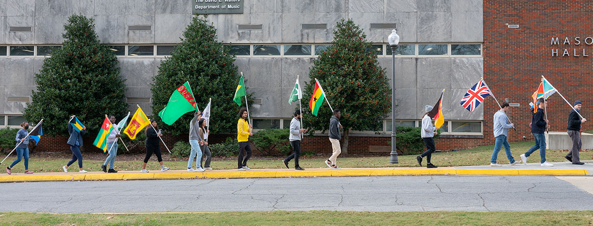 International students displaying the flag of their home country on campus