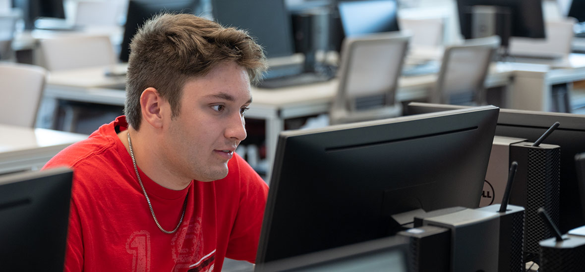 Male student taking classes online