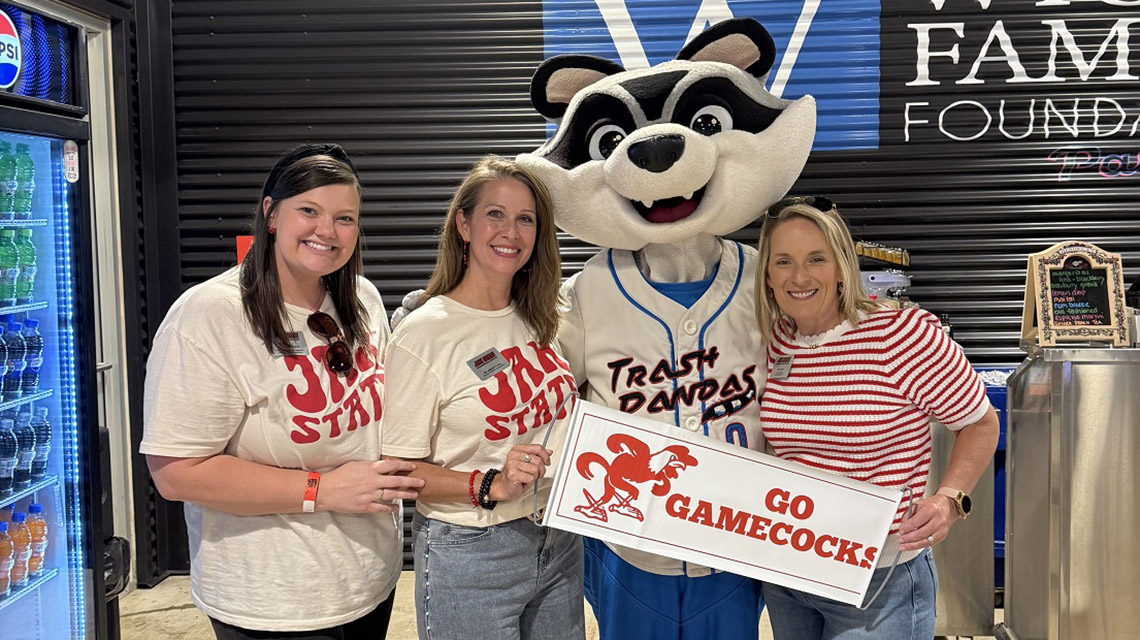 Alumni staff at the Trash Pandas game