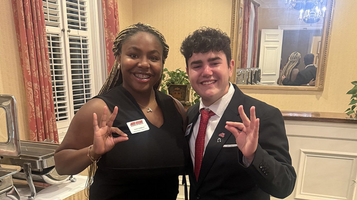 The SGA president and Vice President of Public relations pose for a photo