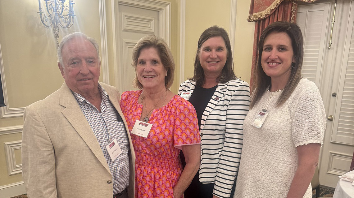 JSU Alumni and friends smile for a photo