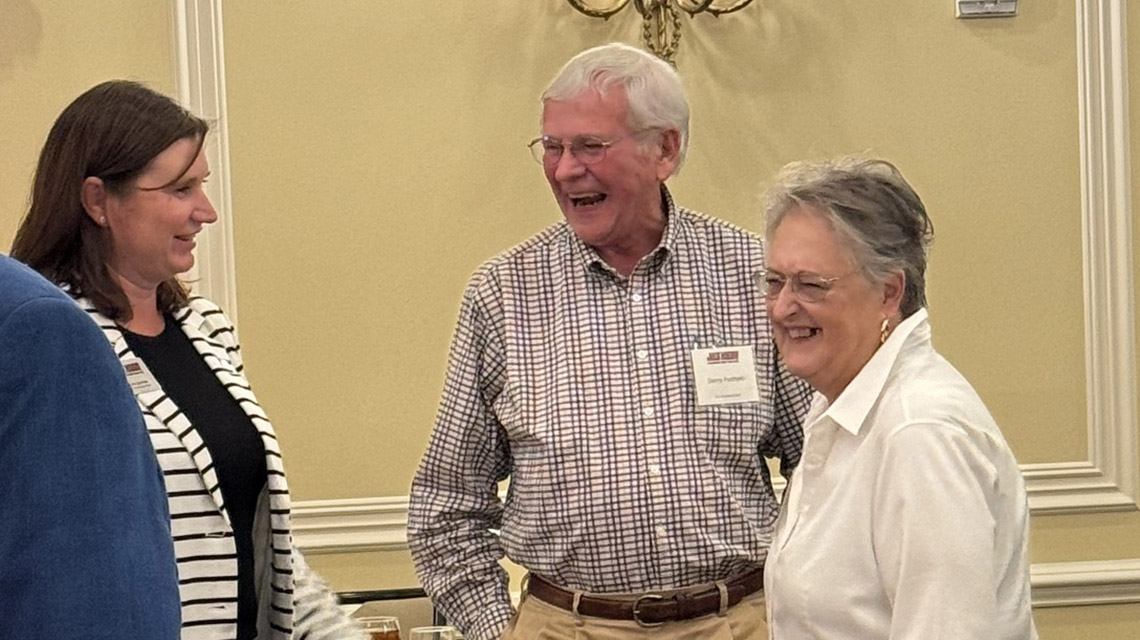 friends laugh as they catch up on old times