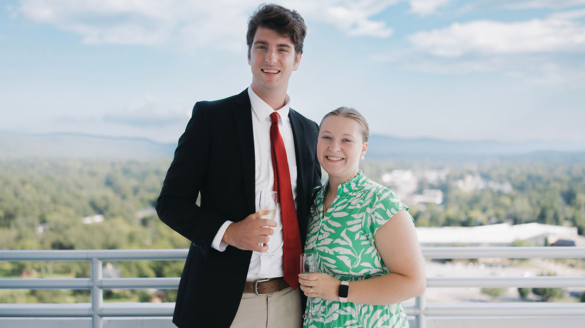 A young couple toasts to their achievements
