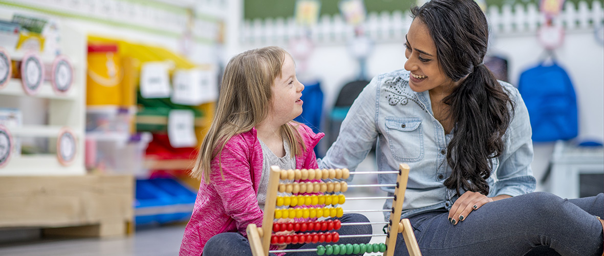 Special Education Student Teacher Assisting Student