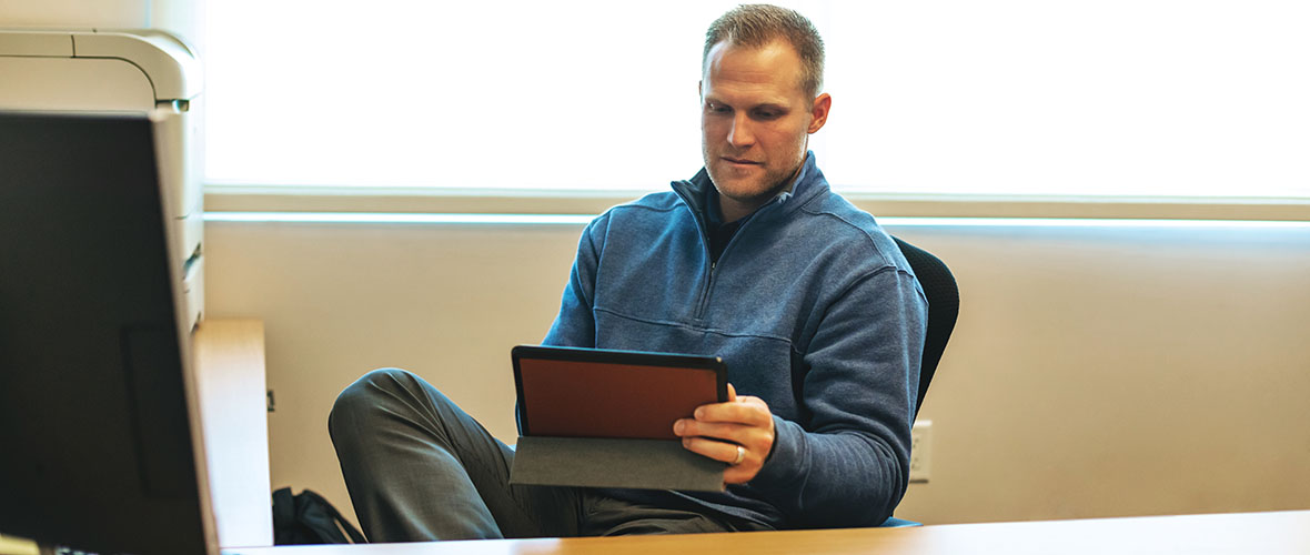 Athletic Director at desk