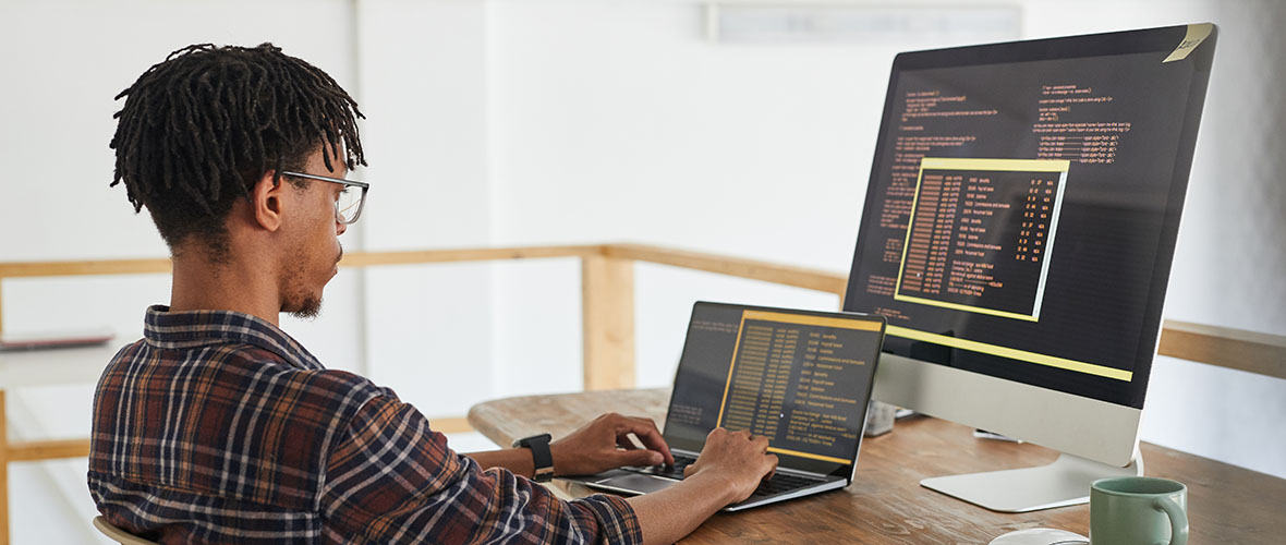 CIS Student working on computer