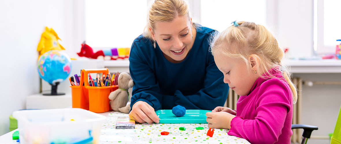 Female teacher and group student teenagers in the classroom