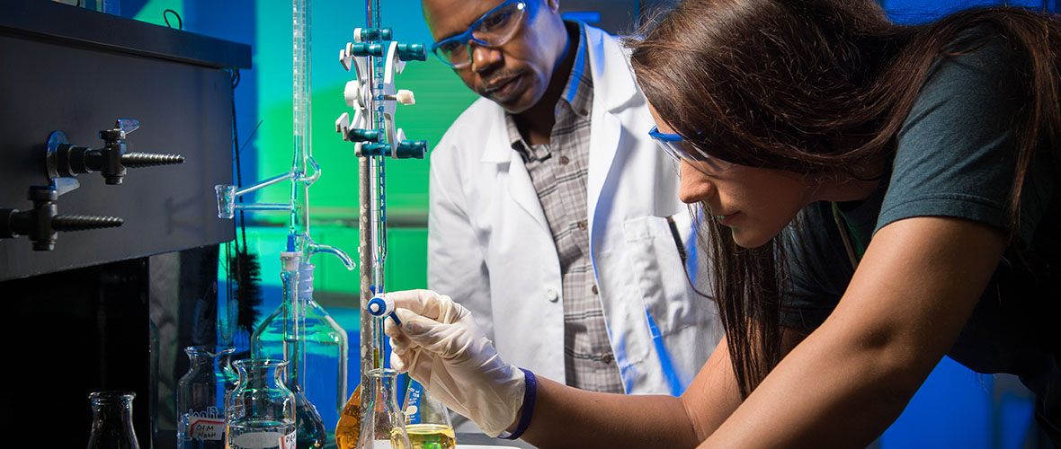 Student and professor in chemistry lab