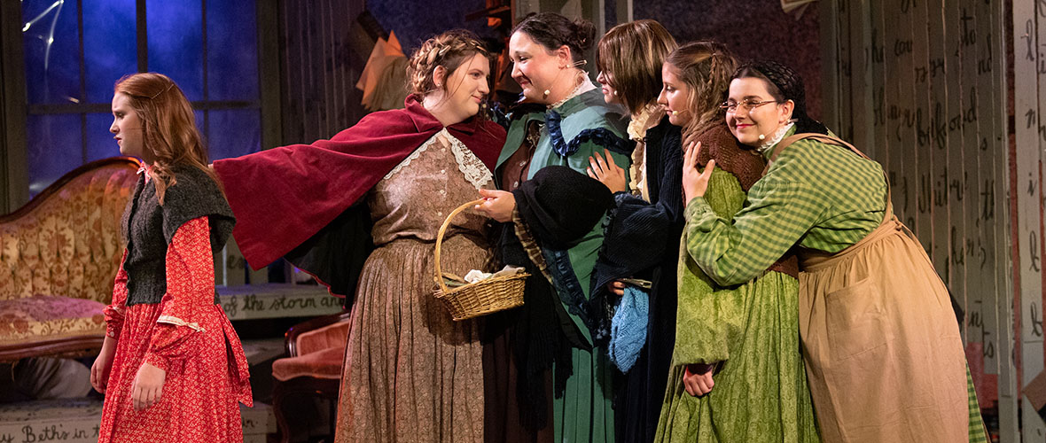 Cast of Little Women performing on stage