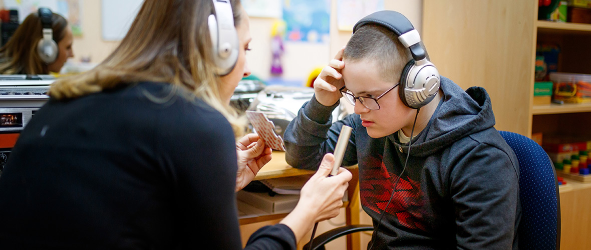 Special Education Student Teacher Assisting Student