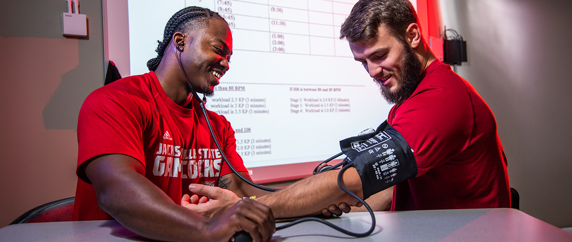 Students in Jax State's fitness lab taking blood pressure