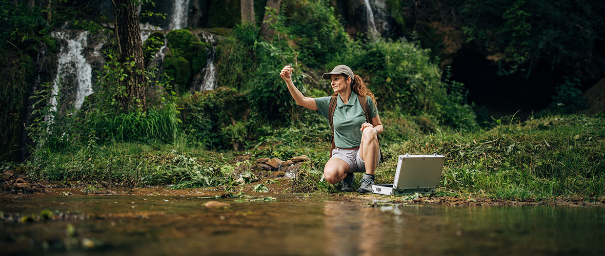 Woman Biological Researcher Taking a Water Sample