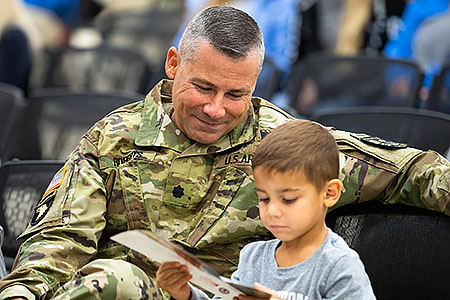 Miltary connected father with small child