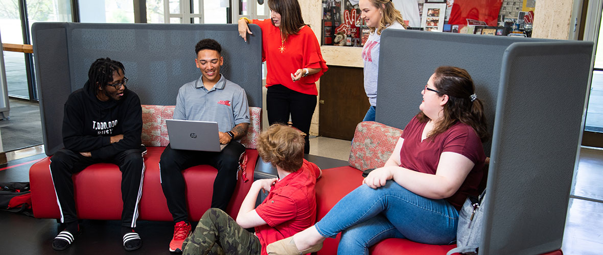 Students talking in the library