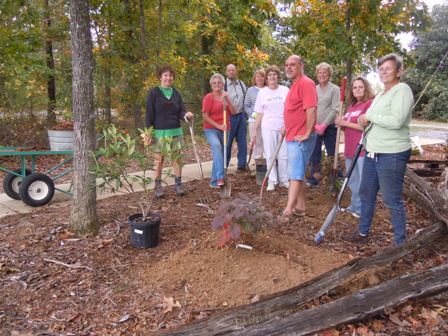 DeKalb and Cherokee County Master Gardeners planting a tree at the Canyon Center