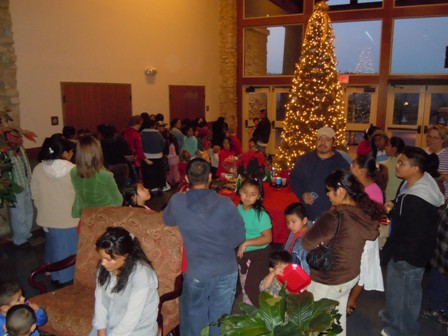 Canyon Center visitors gathered around the Christmas tree