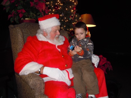 A little boy in Santa's lap at the Canyon Center