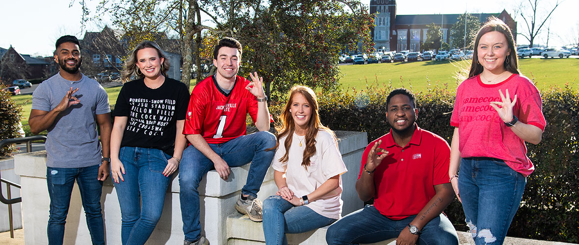 Students sitting outside the Houston Cole library