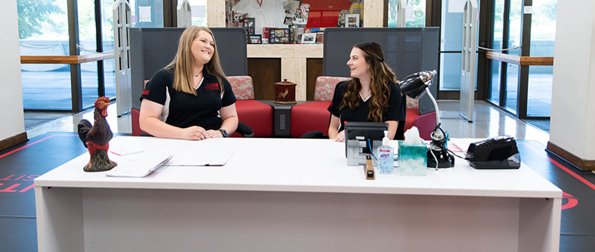 Two student workers at the Houston Cole Library