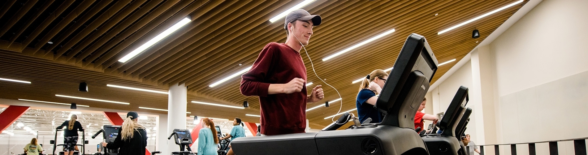 a student runs on a treadmill in the Rec Center
