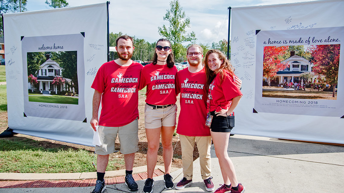 Banners depicting the former alumni house were available for signing on the site on Homecoming morning