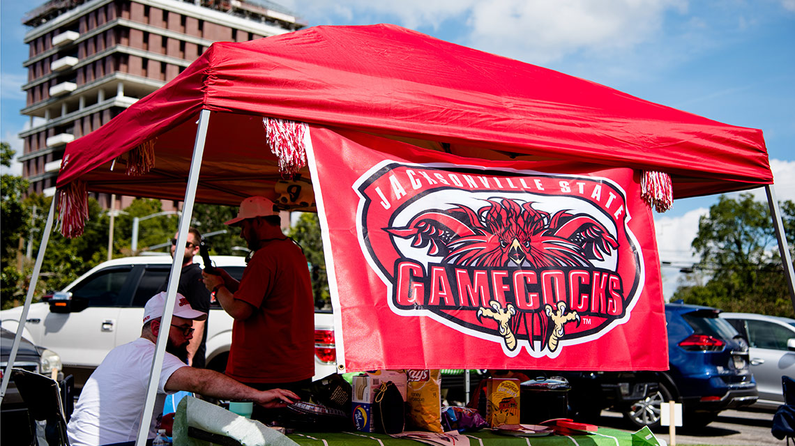Homecoming tailgaters display their JSU flag proudly