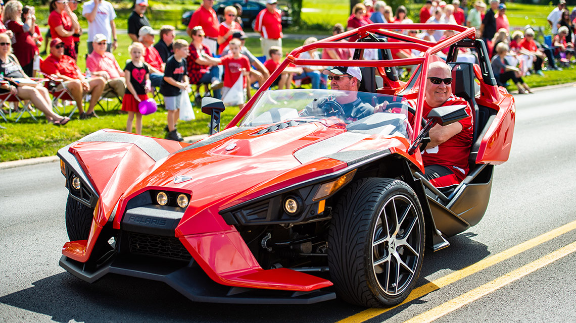 Wayne Spears drives his three wheeled Polaris Spyder in the homecoming parade