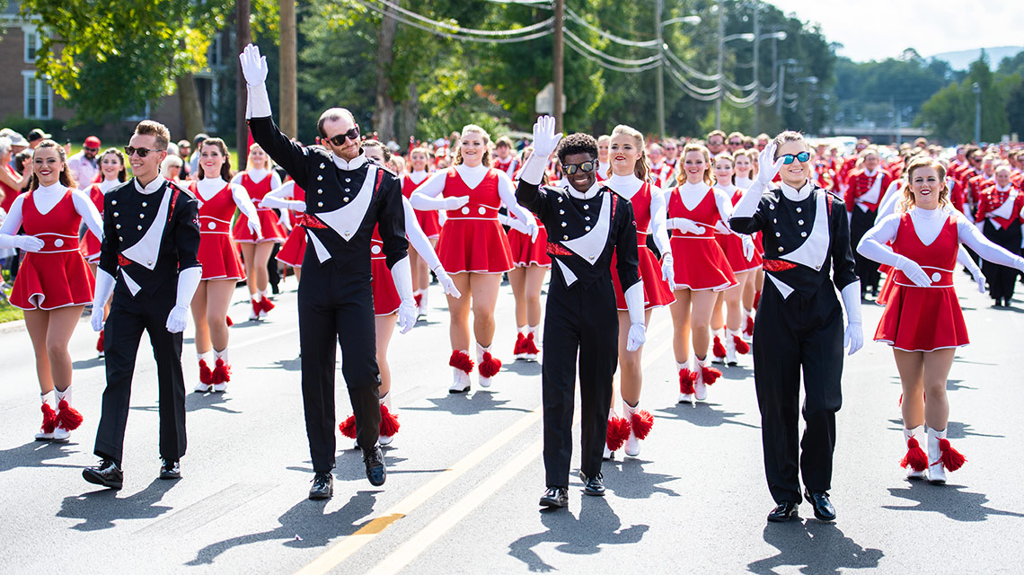 Drum majors followed by the Ballerinas in the homecoming parade