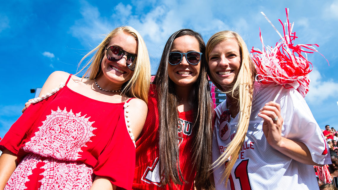Female students enjoying the game from the stands