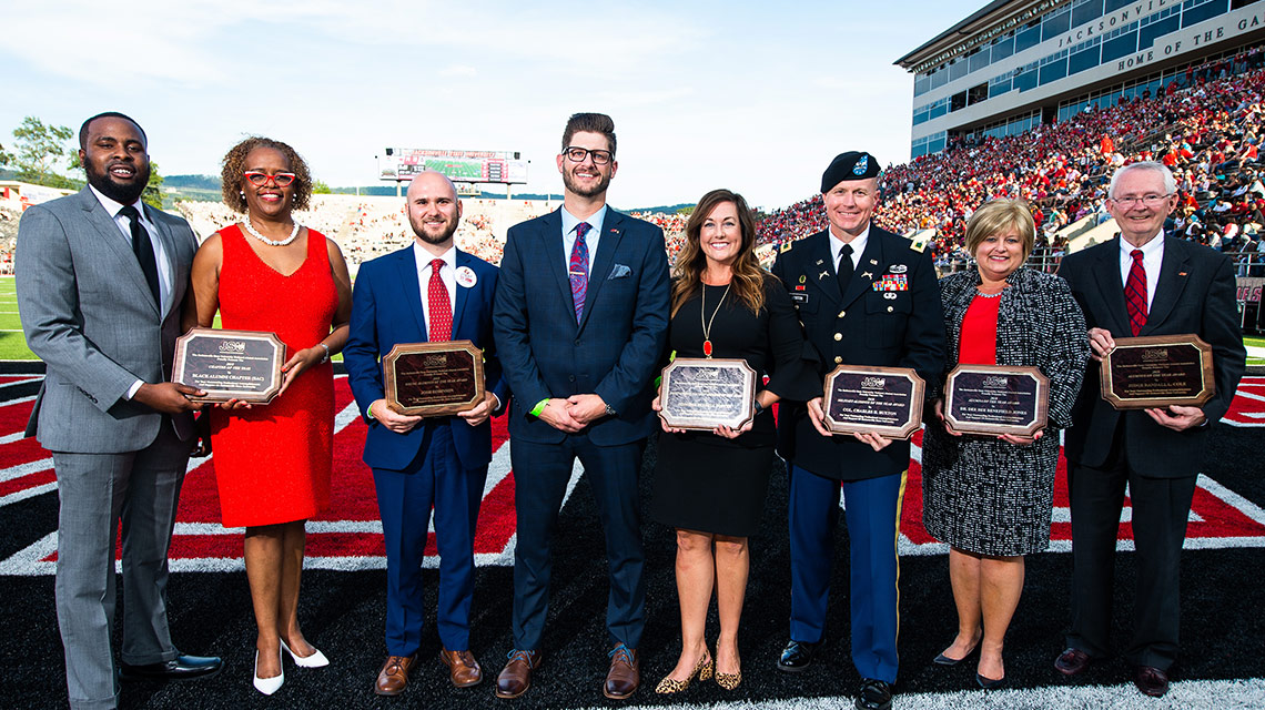 2018 Alumni of the year at halftime