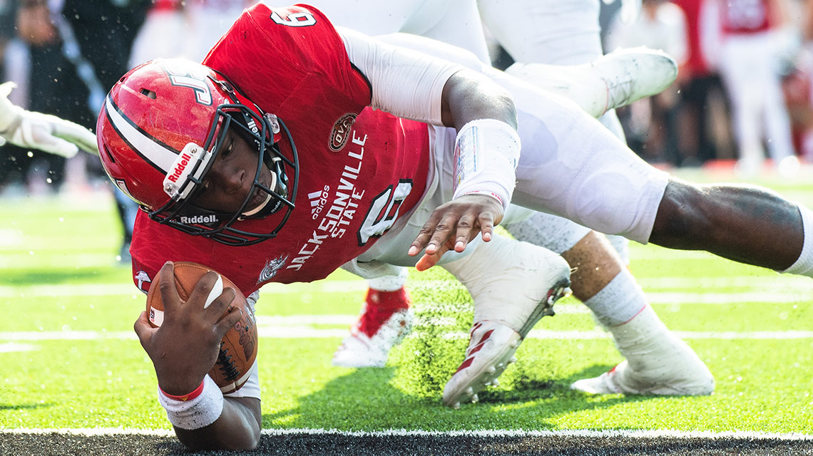 Quarterback Zerrick Cooper runs the ball during the homecoming game