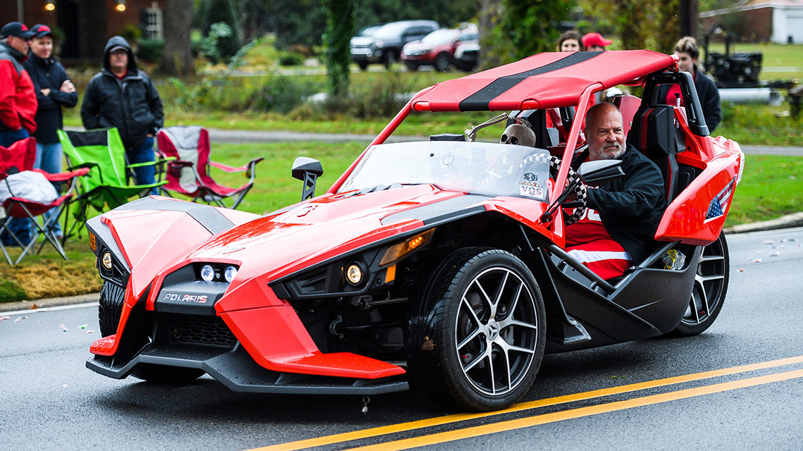 Casper Wayne Spears drives his "spider" vehicle in the parade