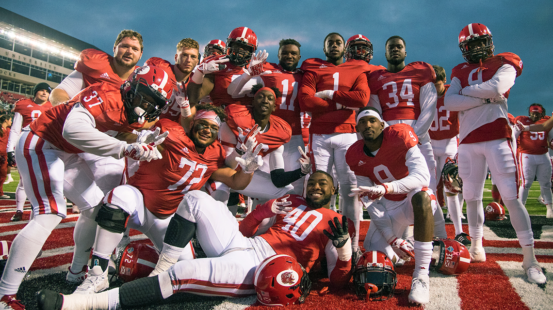 Football team poses after their homecoming win