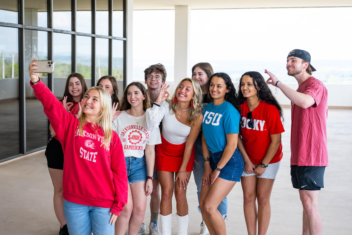 Honors Program students pose for a selfie on top of Houston Cole Library.