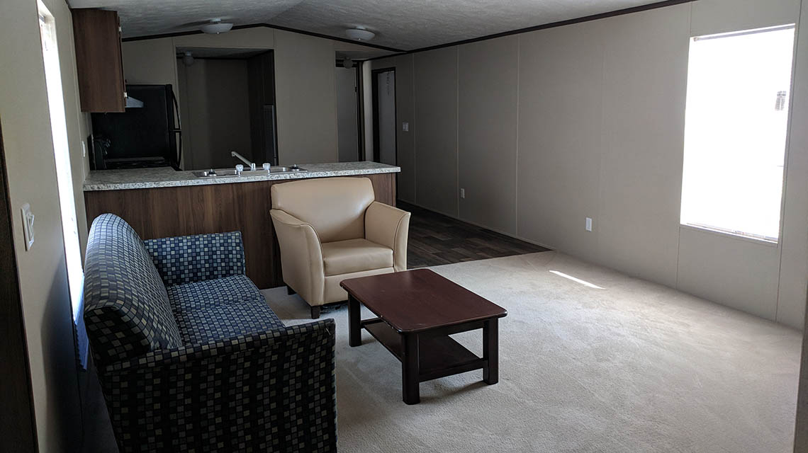 Interior shot showing couch, chair, and coffee table