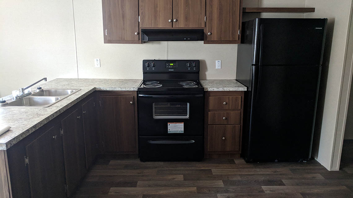 kitchen, shoing sink, range, and refrigerator