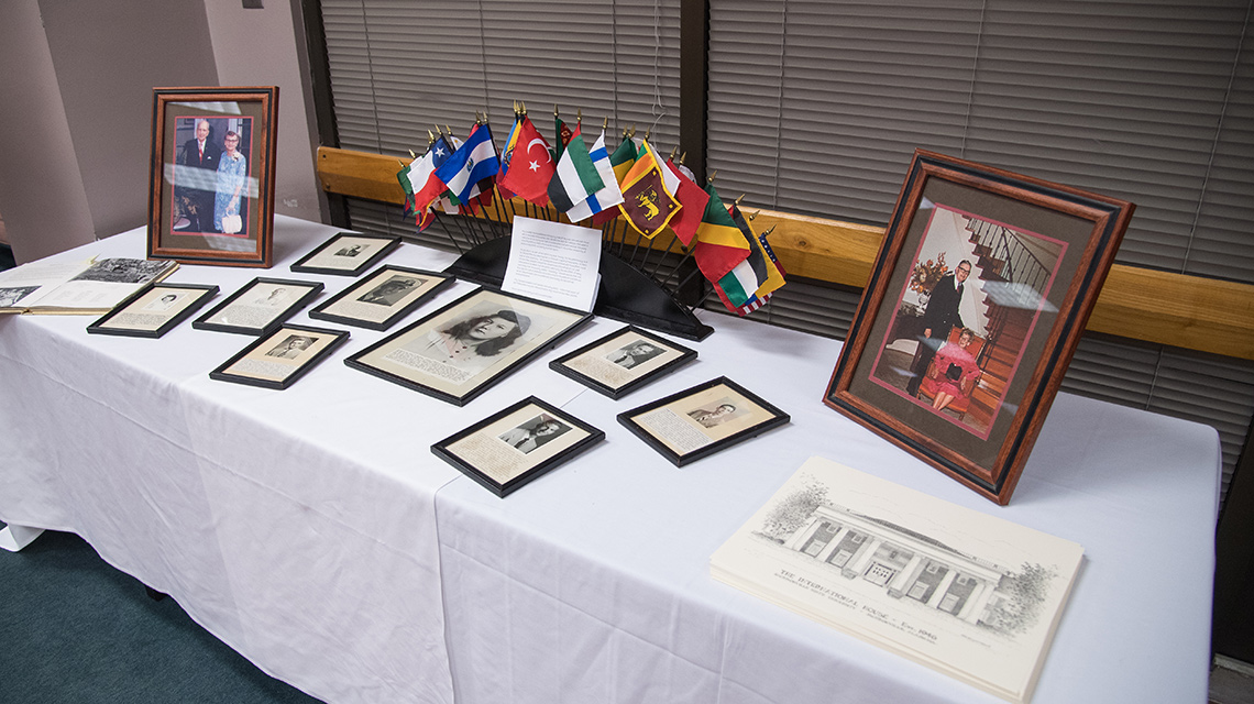 A display of international flags sits amid memorabilia at a past IH reunion
