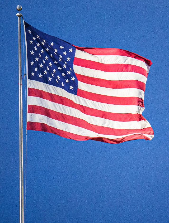 The American flag flies on campus