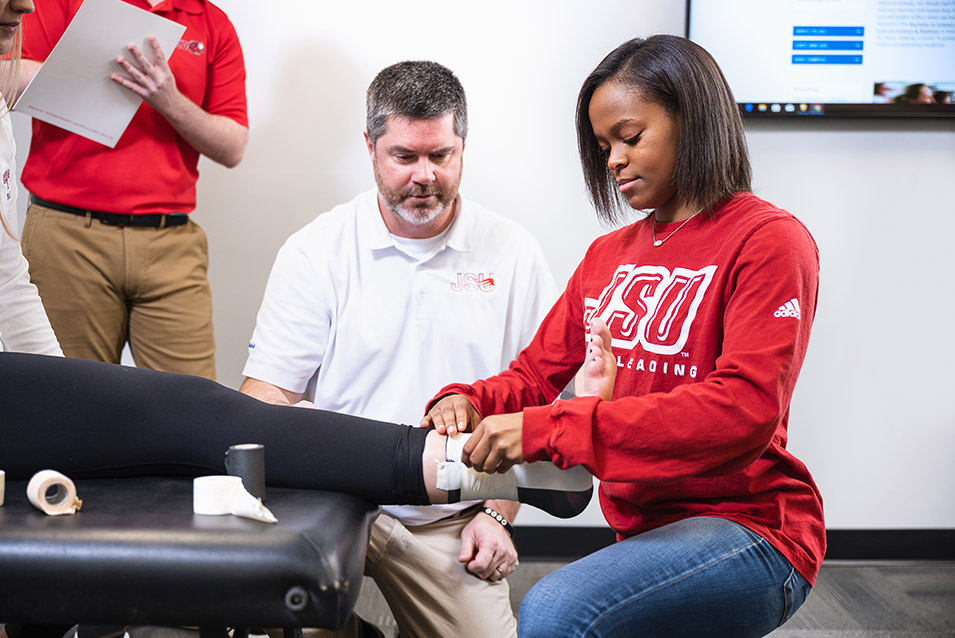 Student Wrapping Ankle