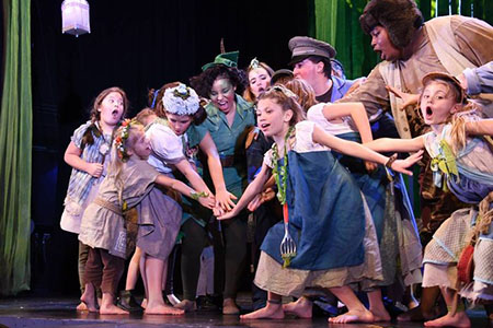 Group photo of students on stage